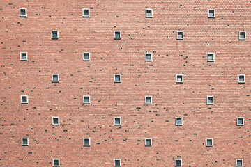 Brick facade with tiny windows