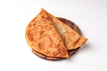 Cheburek, pasties with meat, food on a white background, isolated