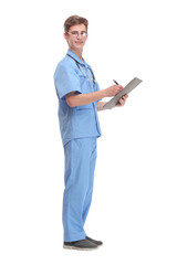 Side view of concentrated male doctor writing reports
