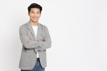 Young Asian businessman smilling with arms crossed isolated on white background - 530113938