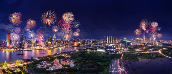Celebration. Aerial view with fireworks light up sky over business district in Ho Chi Minh City ( Saigon ), Vietnam. Holidays, independence day, New Year and Tet holiday