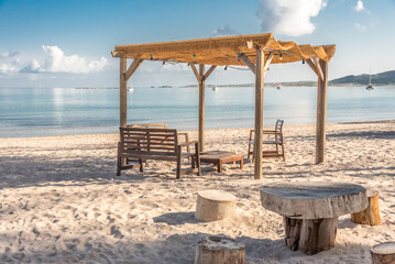 table and chairs on the beach - Powered by Adobe