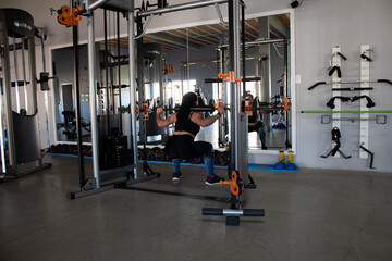 Beautiful brunette working out in a gym