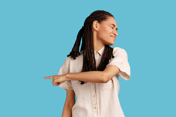 Get out. Irritated upset woman with black dreadlocks pointing away, quarreling and scolding,...