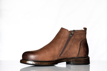 Men's autumn boots made of brown genuine leather isolated on a white background.
