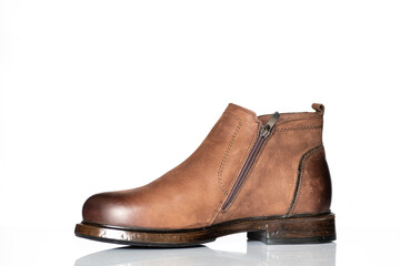 Men's autumn boots made of brown genuine leather isolated on a white background.