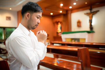 Christian man asking for blessings from God,Asian man praying to Jesus Christ