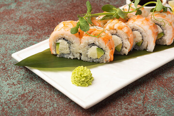 Sushi, rolls, sushi with fish on a textured background, side view