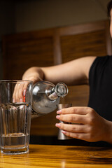 A bartender prepares a cocktail at the restaurant bar
