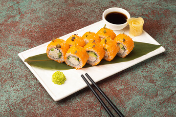 Sushi, rolls, sushi with fish on a textured background, side view