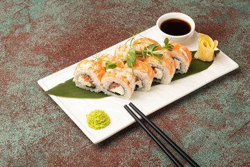Sushi, rolls, sushi with fish on a textured background, side view