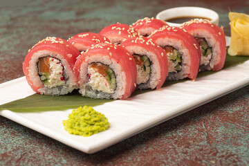 Sushi, rolls, sushi with fish on a textured background, side view