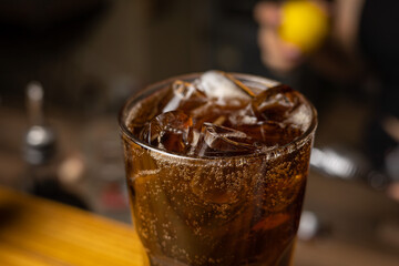 A bartender prepares a cocktail at the restaurant bar
