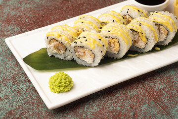 Sushi, rolls, sushi with fish on a textured background, side view