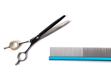 Groomer tool. Set of various combs and scissors for pet hair care on a white background.