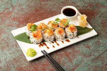 Sushi, rolls, sushi with fish on a textured background, side view