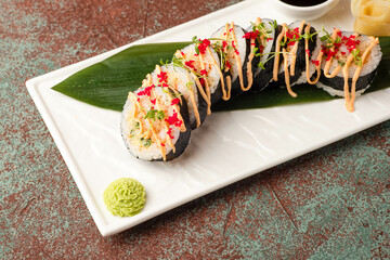 Sushi, rolls, sushi with fish on a textured background, side view
