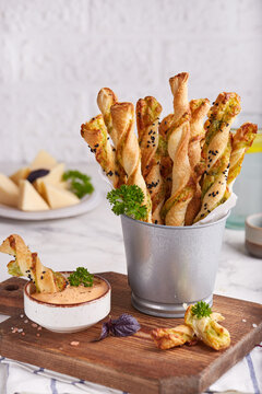 Bread sticks grissini with parmesan cheese and spinach filling. Savory snack. Delicious homemade appetizer.