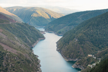 Views of the Salime reservoir from Paicega. Landscape of river and mountains.