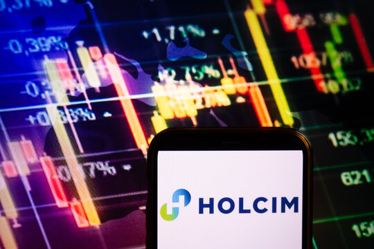 KONSKIE, POLAND - September 10, 2022: Smartphone displaying logo of Holcim company on stock exchange chart background