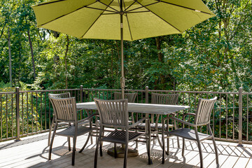 Outdoor patio set green umbrella deck summer sun