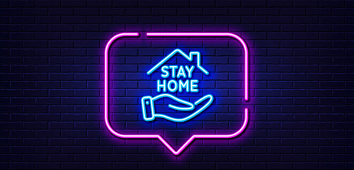 Neon light speech bubble. Stay home line icon. Coronavirus pandemic quarantine sign. Save lives symbol. Neon light background. Stay home glow line. Brick wall banner. Vector