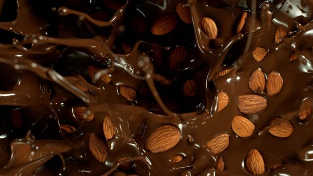Super Slow Motion of Falling Almonds Into Melted Chocolate. Filmed on High Speed Cinema Camera, 1000fps.