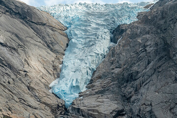 Melting ice mountain landscape, Norway. Briksdal glacier in Jostedalsbreen national park. Global warming concept.