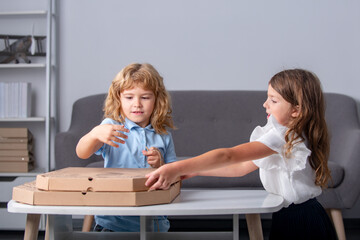 Children open pizza box at home. Kids preparing to eat pizza. Vegetarian fast Italian food, cute little kids enjoying delivery Pizza pepperoni, in cardboard box at home.