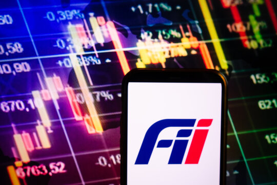 KONSKIE, POLAND - September 10, 2022: Smartphone displaying logo of Foxconn Industrial Internet company on stock exchange chart background