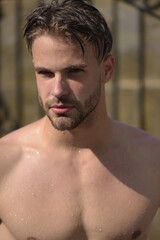 Obraz premium Sexy wet gay. Young man with naked torso.