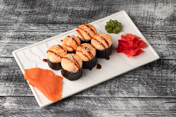 Sushi, rolls, sushi with fish on a white wooden background