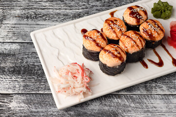 Sushi, rolls, sushi with fish on a white wooden background