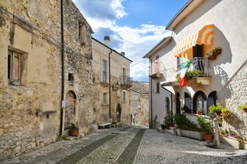 A narrow street between the old stone houses of Caramanico Terme, a medieval village in the Abruzzo region of Italy.