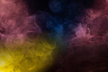 Yellow and pink steam on a black background.