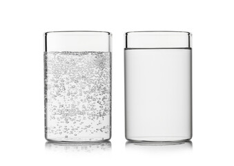 Mineral sparkling and still water in highball glass on white background. For active and healthy...