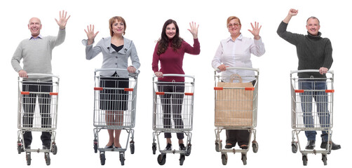 group of people with shopping cart showing thumbs up at camera