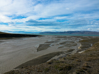 Snowless arctic landscape. Seen on Barentsoya island. Spitsbergen, Svalbard, Norway. Tourism and vacation concept.