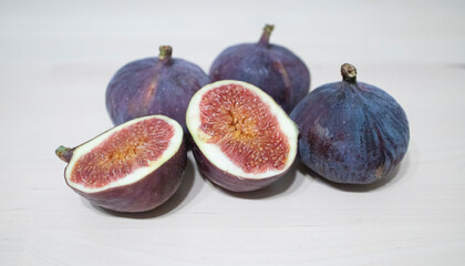 figs on a light table surface. Exotic fruits, vitamins, problems with the supply of fruit to Russia