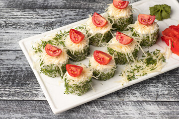 Rolls, sushi with fish on a white wooden background