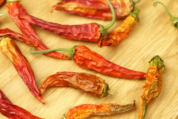 Chili peppers, dried red peppers on a wooden table, background, dry paprika