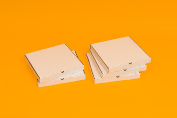 pizza boxes on yellow background