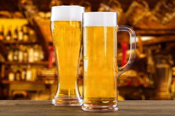 Two glasses with beer in bar, drink concept