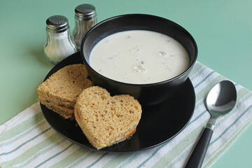 Heart shaped ham sandwiches with cream of mushroom soup for lunch. A treat for the kiddos.