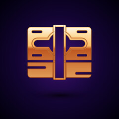 Gold Stacks paper money cash icon isolated on black background. Money banknotes stacks. Bill currency. Vector