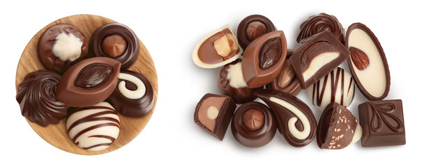 Chocolate candy in wooden bowl isolated on white background with full depth of field. Top view. Flat lay