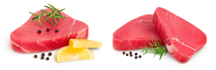 Fresh tuna fish fillet steak with rosemary, lemon and peppercorns isolated on white background with...