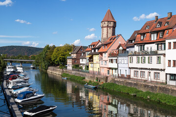 Obraz premium Monumental old watchtower along the river Tauber in the small town of Wertheim in Bavaria, Germany