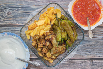 Traditional delicious Turkish food, fried mixed vegetables (potatoes, eggplant, zucchini, roasted peppers), Turkish name; mixed fried vegetables