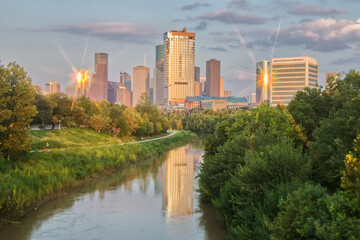 Houston Skyline Reflected in Bayou During Golden Hour with Eight Point Star on Buildings from...